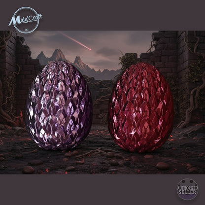 Œufs de dragon 3D Maly’Craft violet et rouge, design écaille brillant inspiré de la fantasy. Décor épique de ruines et montagnes, ambiance magique et artisanat 3D de qualité.