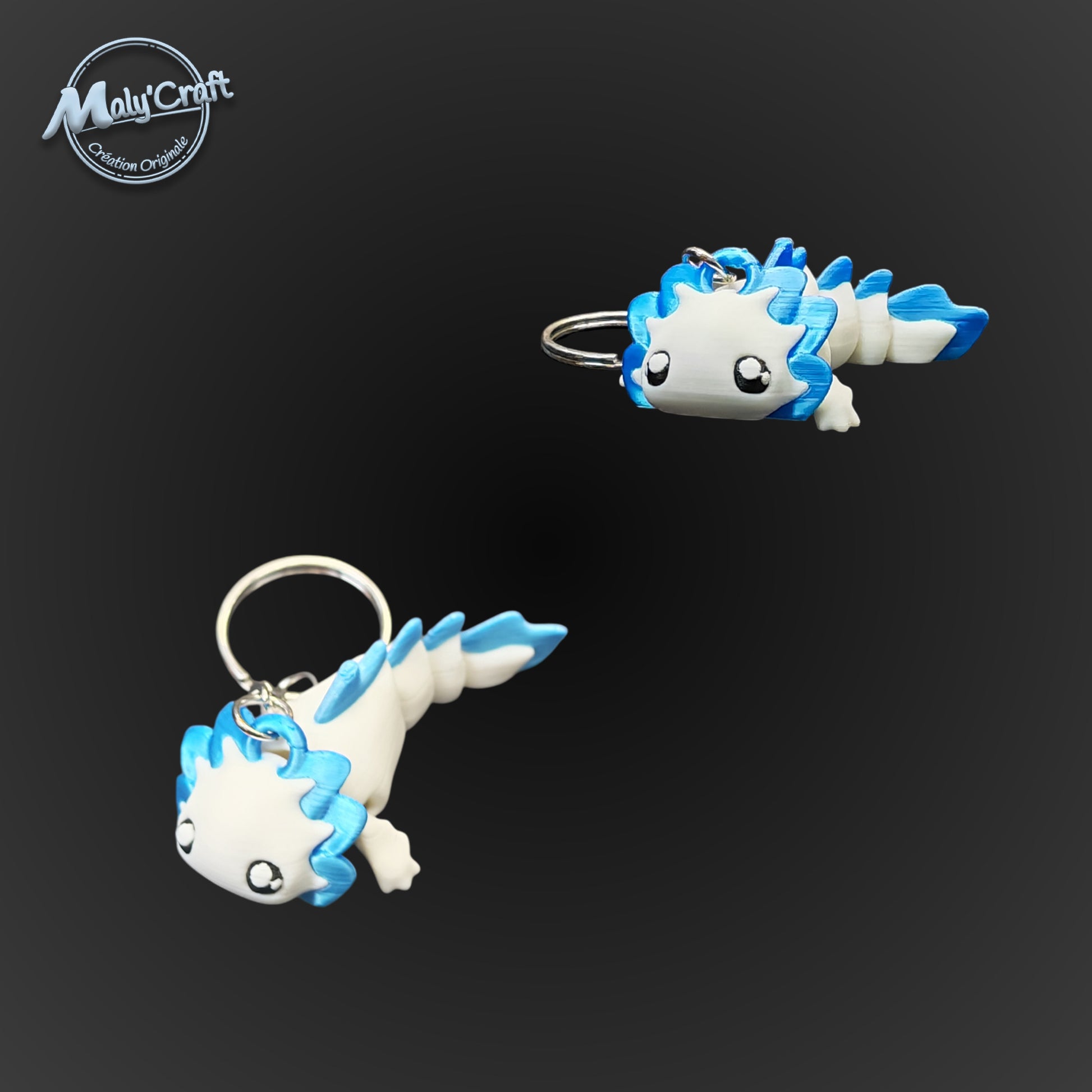 Zoom sur deux axolotls bleu et blanc, soulignant la douceur des formes et la qualité de l'assemblage manue