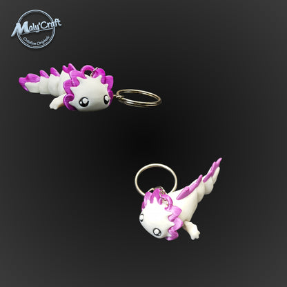 Zoom sur deux axolotls violet et blanc, soulignant la douceur des formes et la qualité de l'impression 3D