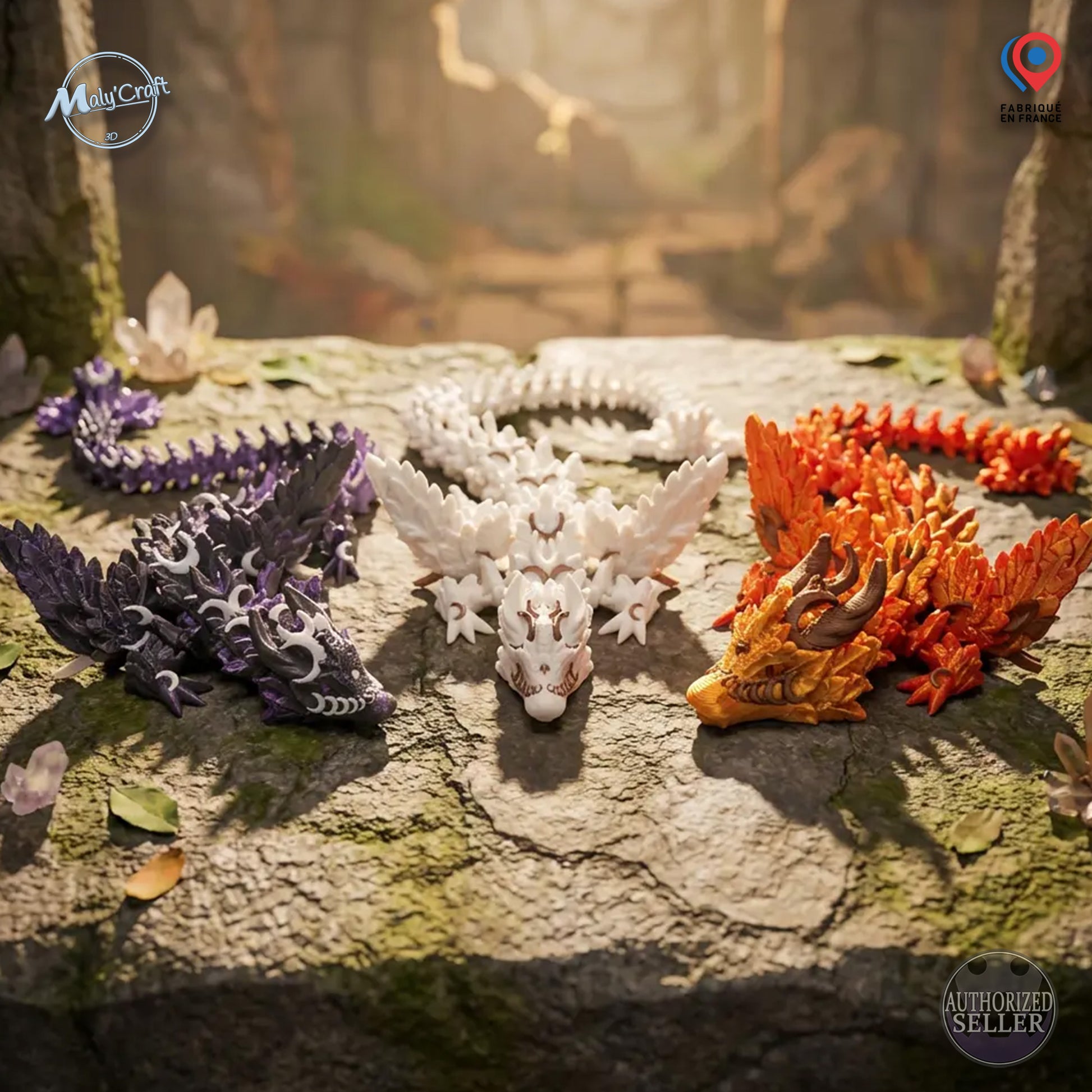 Mise en scène fantasy de dragons articulés Cinderwing avec cristaux. Figurines de collection bicolores imprimées en 3D. L'image affiche les badges de garantie : Fabriqué en France et Vendeur Autorisé Maly'Craft.